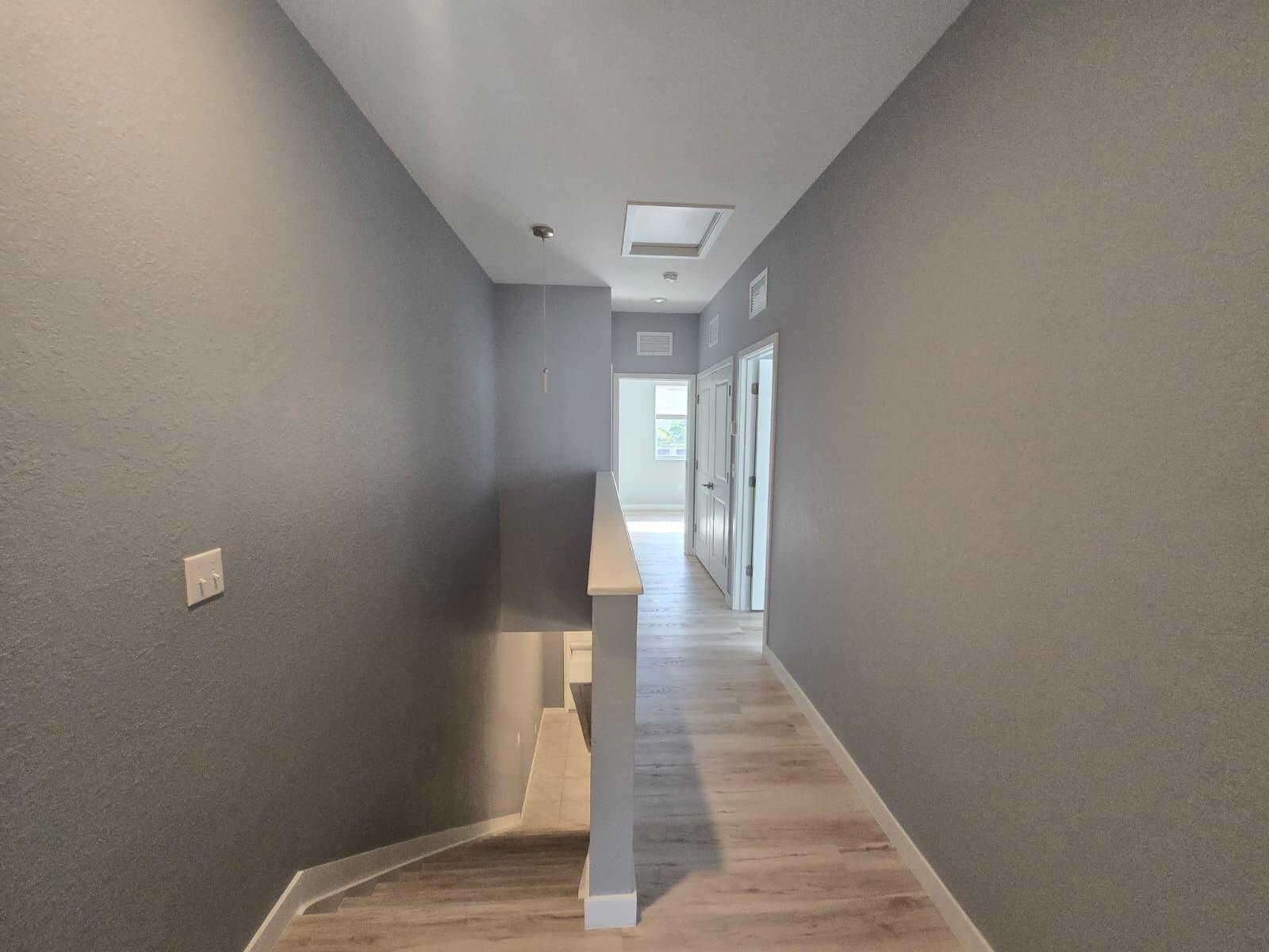 140 Bandol Street Riviera Beach, FL 33404 - Photo 3 of 42 a view of a hallway with a white walls