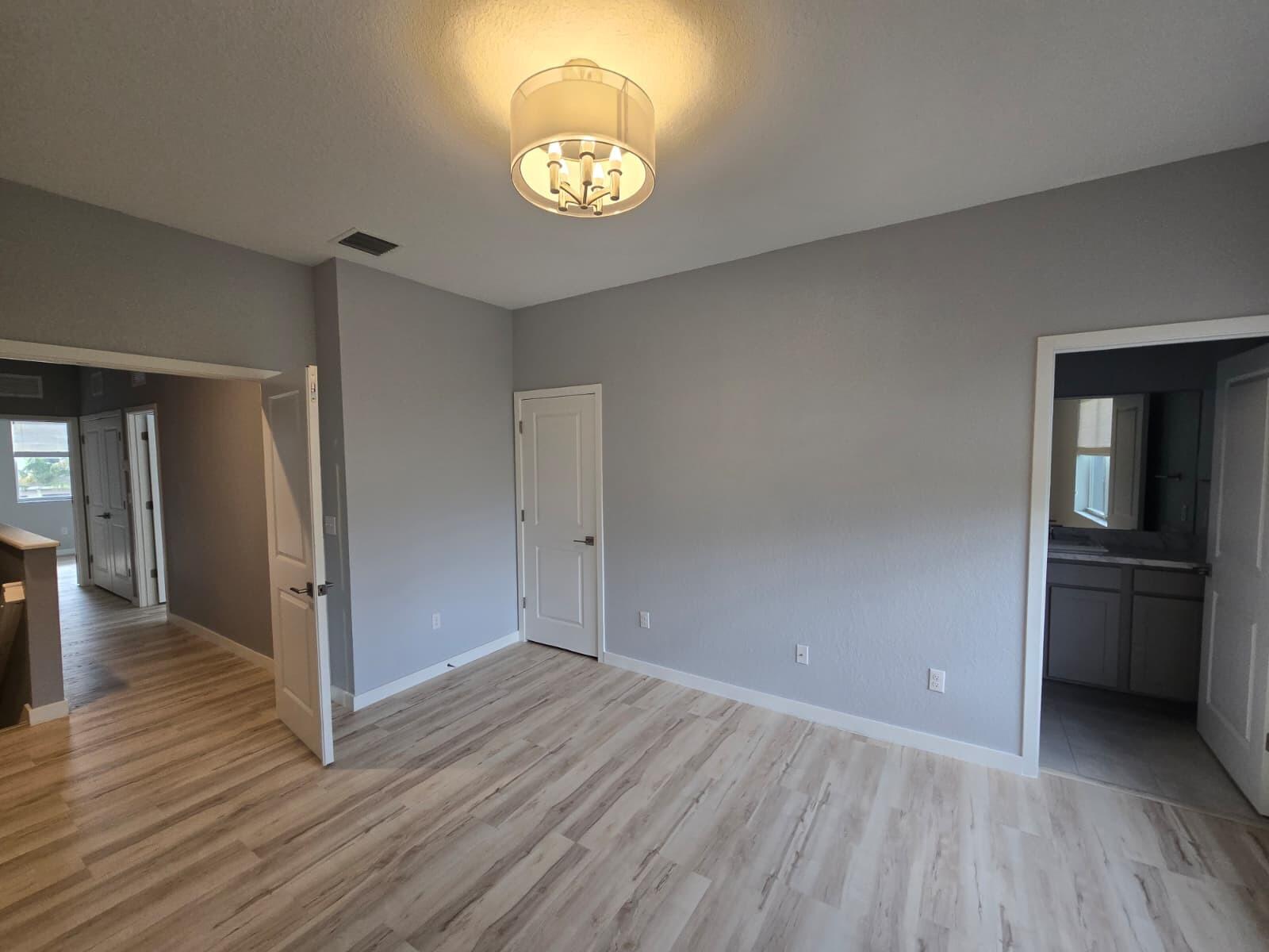 140 Bandol Street Riviera Beach, FL 33404 - Photo 42 of 42 a view of empty room with wooden floor