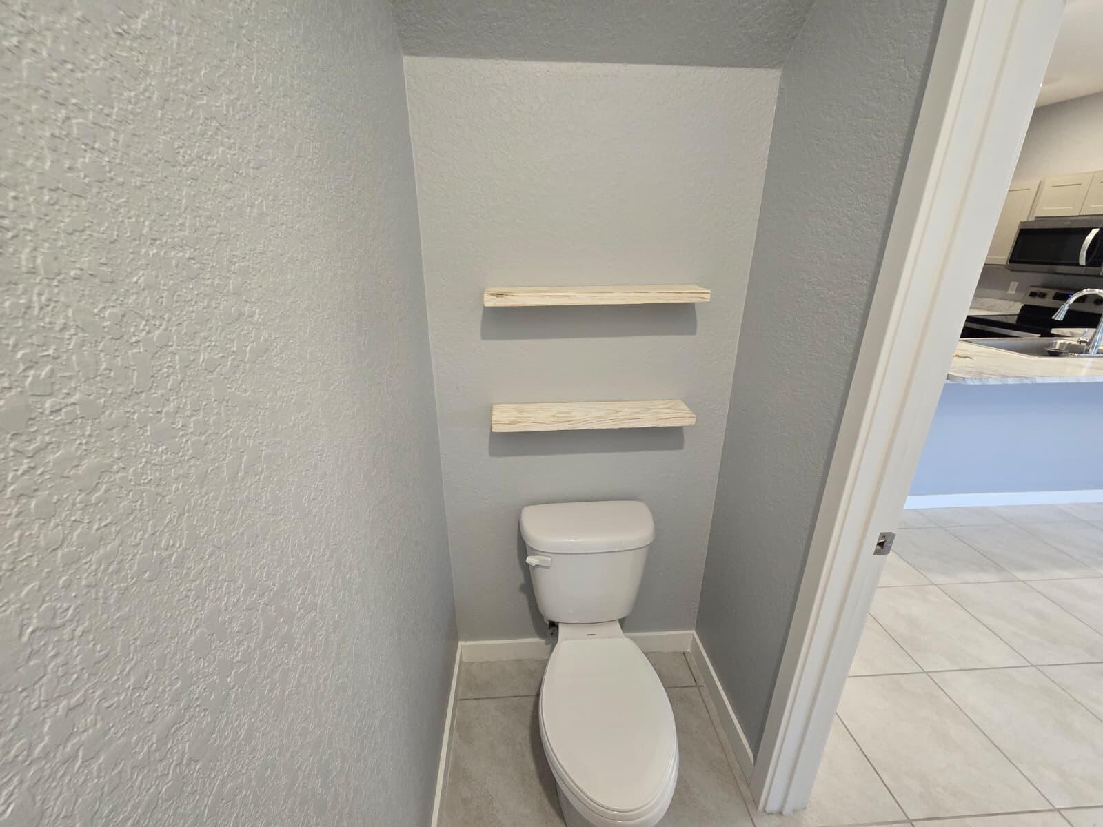 140 Bandol Street Riviera Beach, FL 33404 - Photo 6 of 42 a bathroom with a toilet and a sink