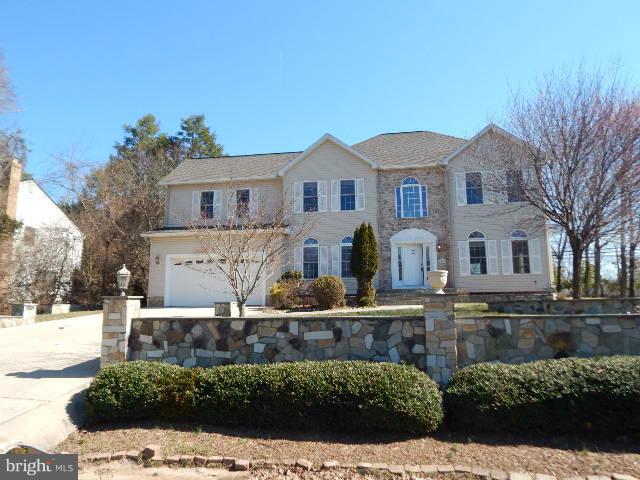 14813 Whitegate Road Silver Spring, MD 20905 - Photo 1 of 17 a front view of a house with a yard