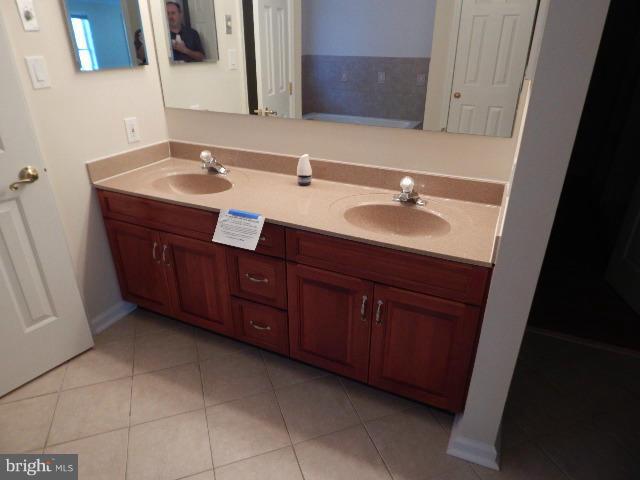 14813 Whitegate Road Silver Spring, MD 20905 - Photo 8 of 17 a bathroom with a sink and a mirror