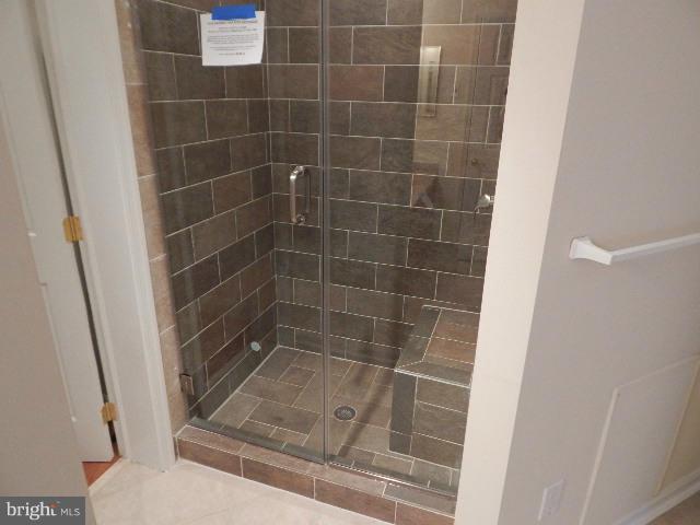 14813 Whitegate Road Silver Spring, MD 20905 - Photo 9 of 17 a bathroom with a glass door shower