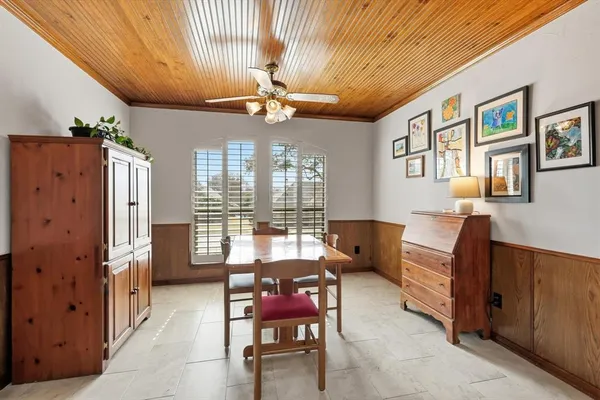 a view of a dining room with furniture wooden floor and chandelier