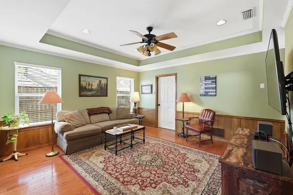 a kitchen with stainless steel appliances granite countertop a refrigerator a stove and a sink with cabinets