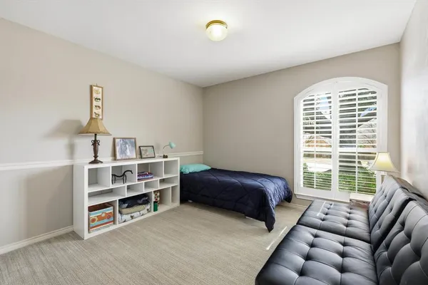 a bathroom with bathtub and window