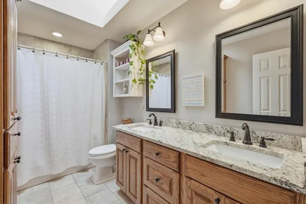 a bedroom with furniture and a large window