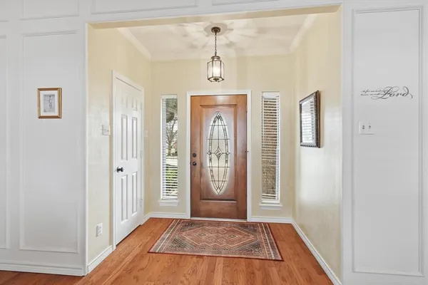 an aerial view of residential houses with city view