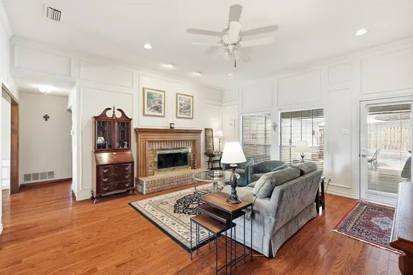 a living room with furniture and a rug