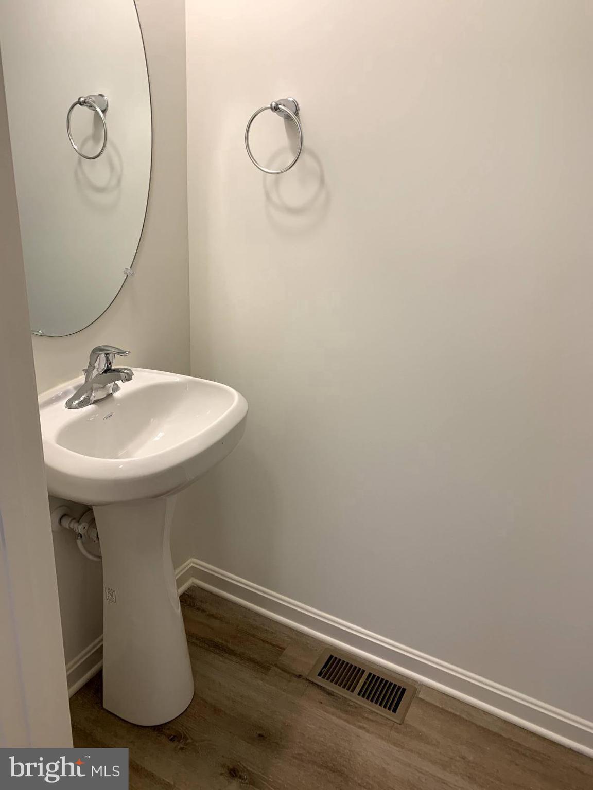 263 Trails Way Joppa, MD 21085 - Photo 14 of 27 a bathroom with a sink and mirror
