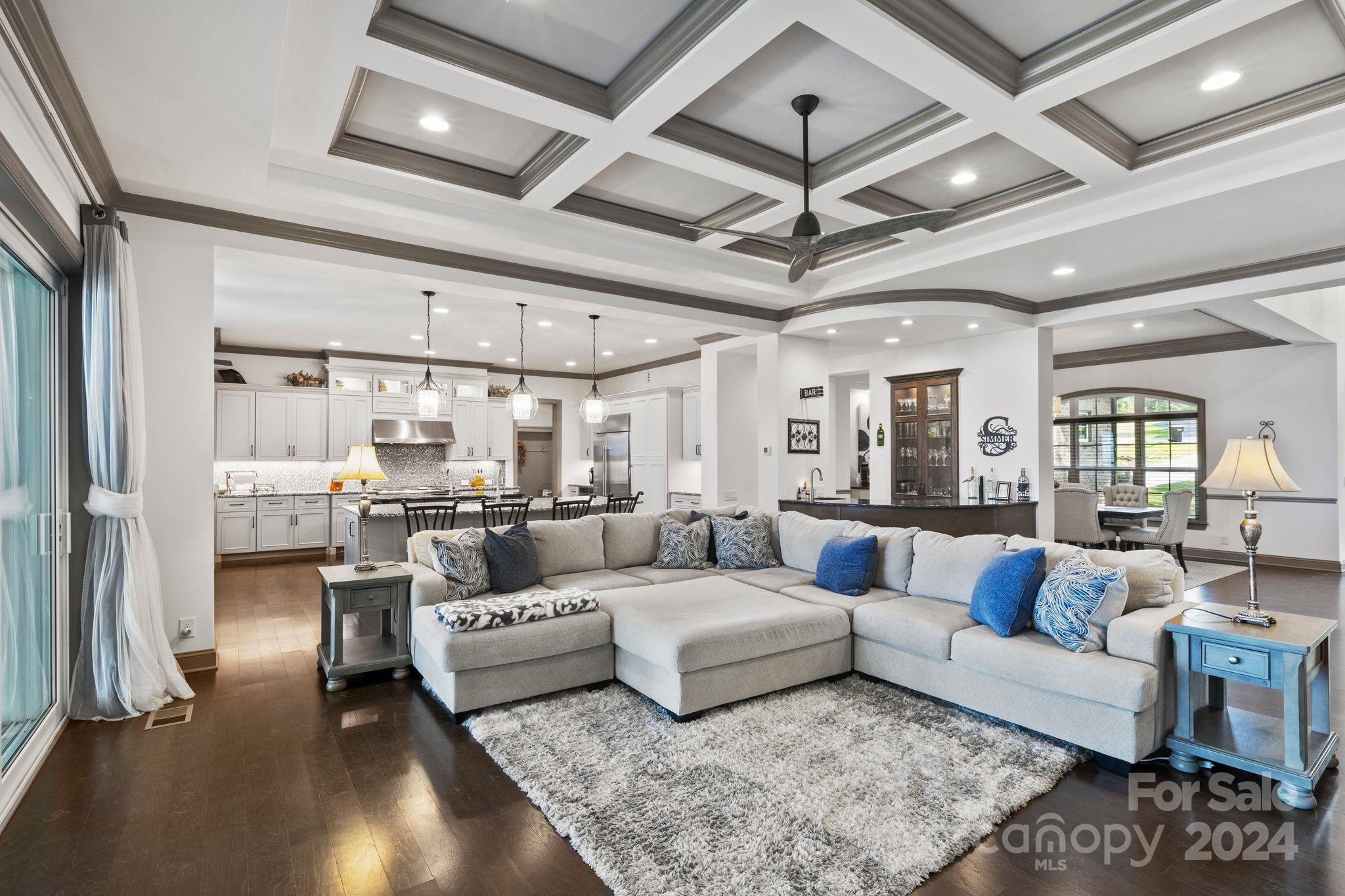7086 Hawk Shadow Denver, NC 28037 - Photo 22 of 48 a living room with furniture and a chandelier