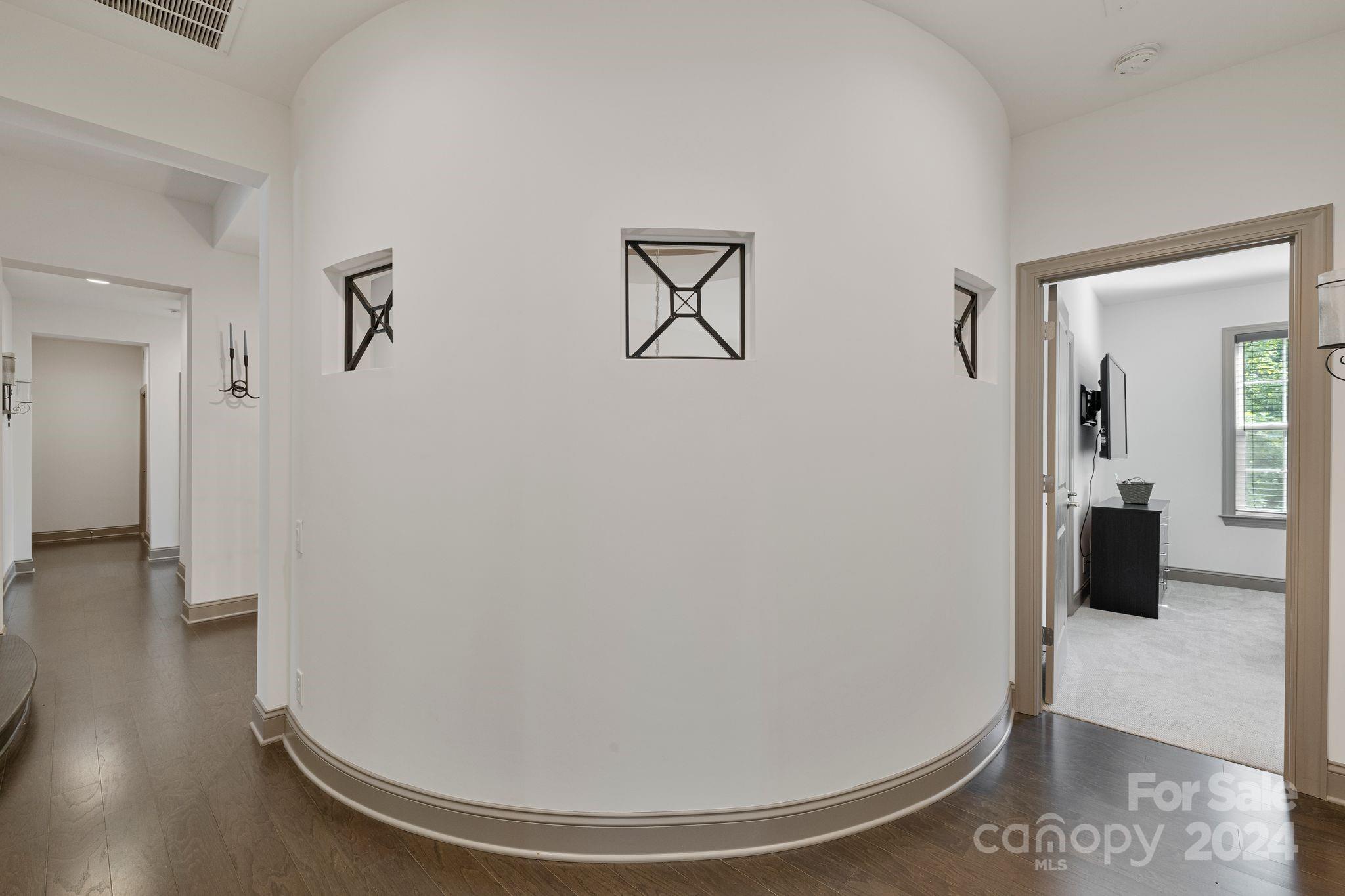 7086 Hawk Shadow Denver, NC 28037 - Photo 37 of 48 a view of a livingroom with wooden floor and a bathroom