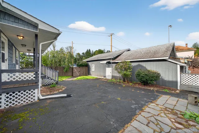 a view of a house with a street