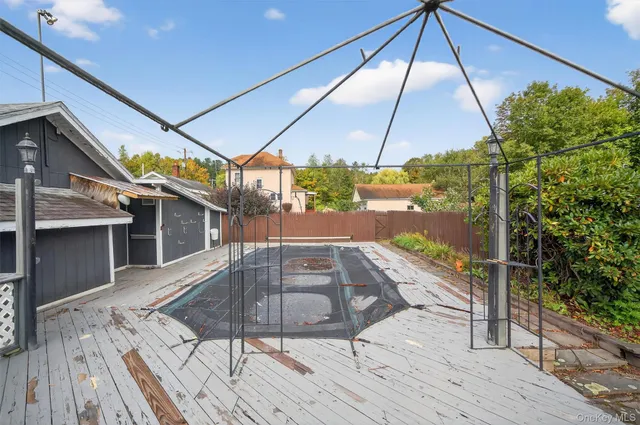 a view of balcony with wooden floor