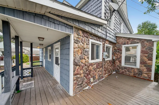 a view of a house with a door and wooden floor