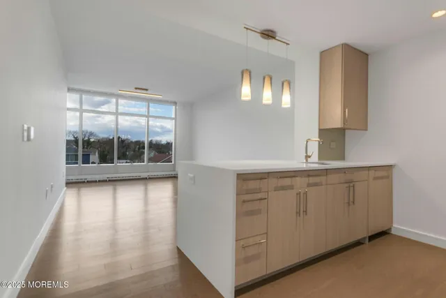 a bathroom with a sink and a large mirror