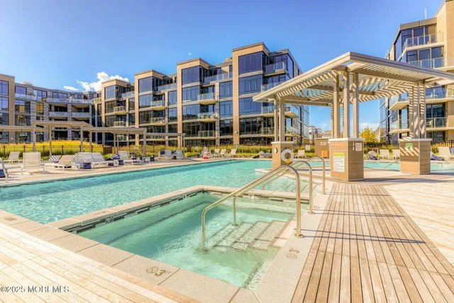 a view of a swimming pool with a lounge chairs
