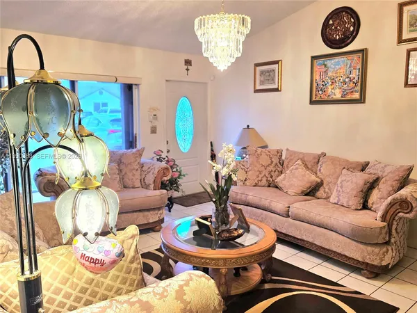 a living room with furniture and a table