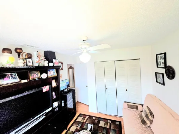 a view of room with cabinet and shelf