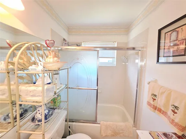 a bathroom with a bathtub and shower