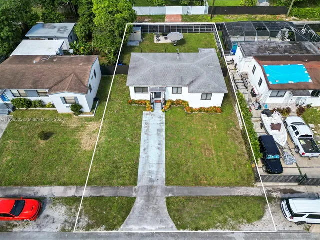 an aerial view of a house with a garden