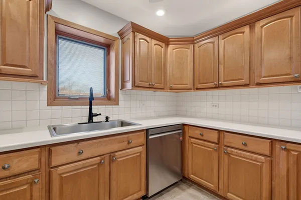 a kitchen with a sink and cabinets
