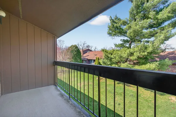 a view of balcony and trees