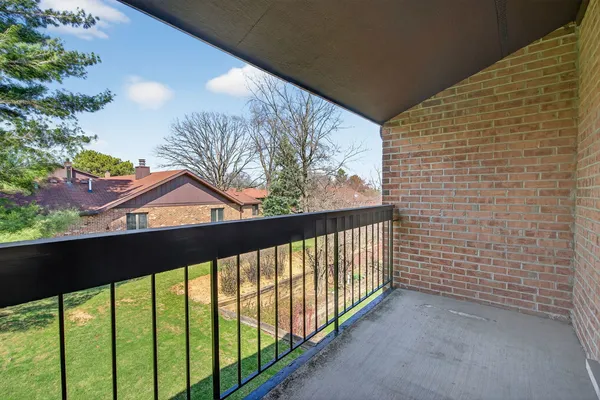 a view of a balcony with a pot