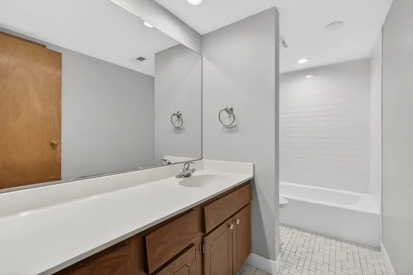 a bathroom with a bathtub and a toilet