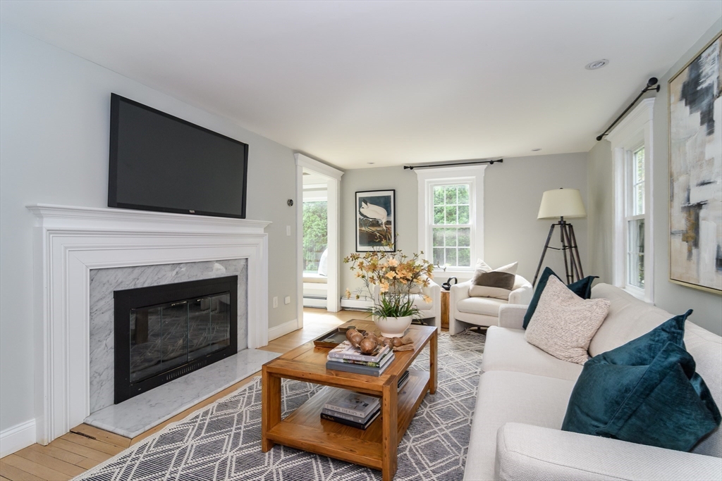1 Roberts Road Wellesley, MA 02481 - Photo 11 of 29 a living room with furniture a flat screen tv and a fireplace