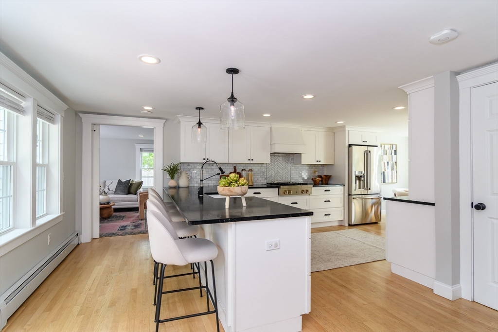 1 Roberts Road Wellesley, MA 02481 - Photo 6 of 29 a view of kitchen with cabinets and wooden floor
