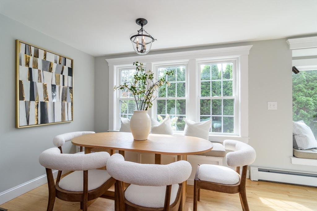1 Roberts Road Wellesley, MA 02481 - Photo 9 of 29 a dining room with furniture a large window and wooden floor