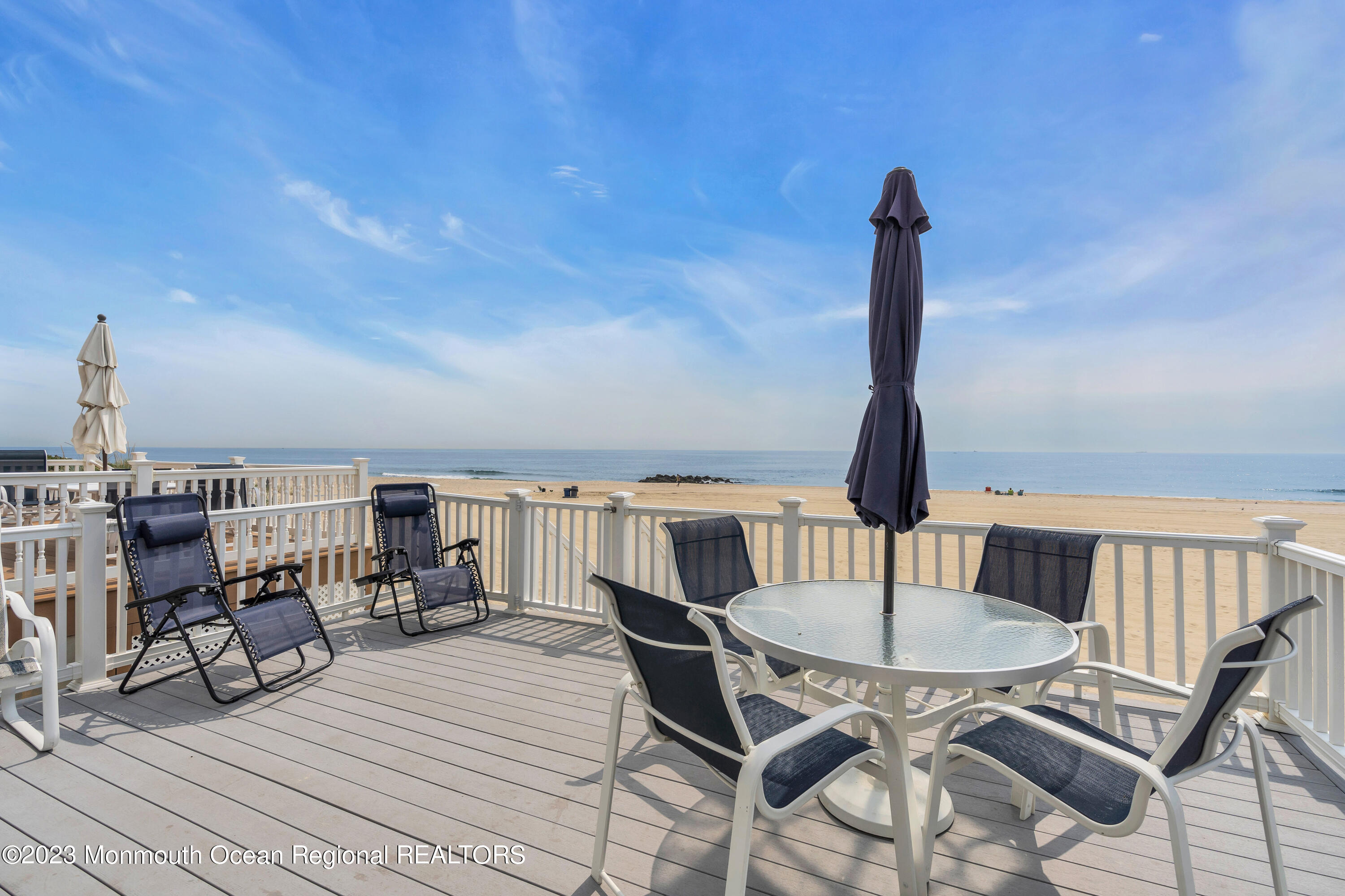 61 Beach Front Manasquan, NJ 08736 - Photo 1 of 20 a view of a chairs and table in the terrace