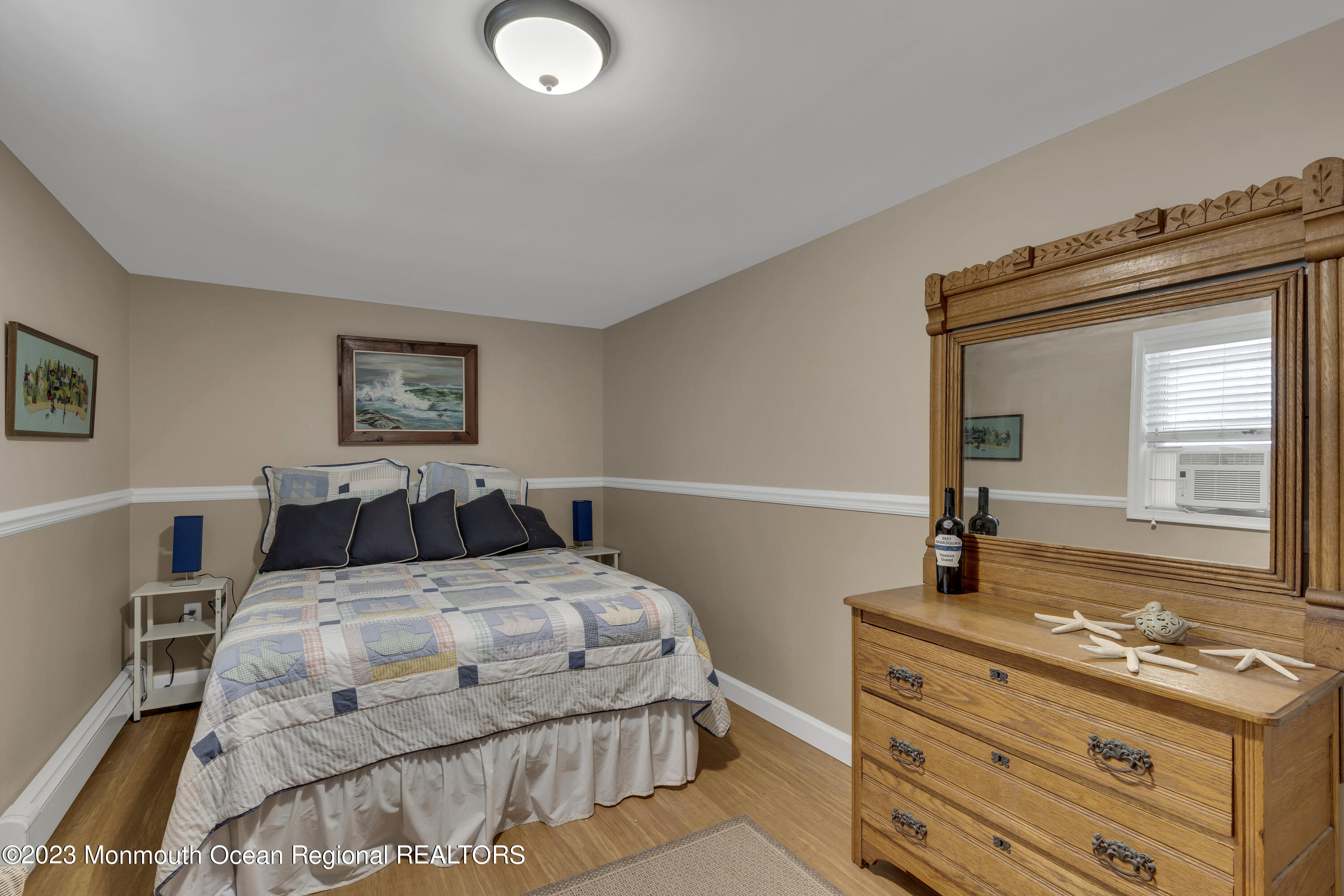 61 Beach Front Manasquan, NJ 08736 - Photo 12 of 20 a bedroom with a bed and a dresser