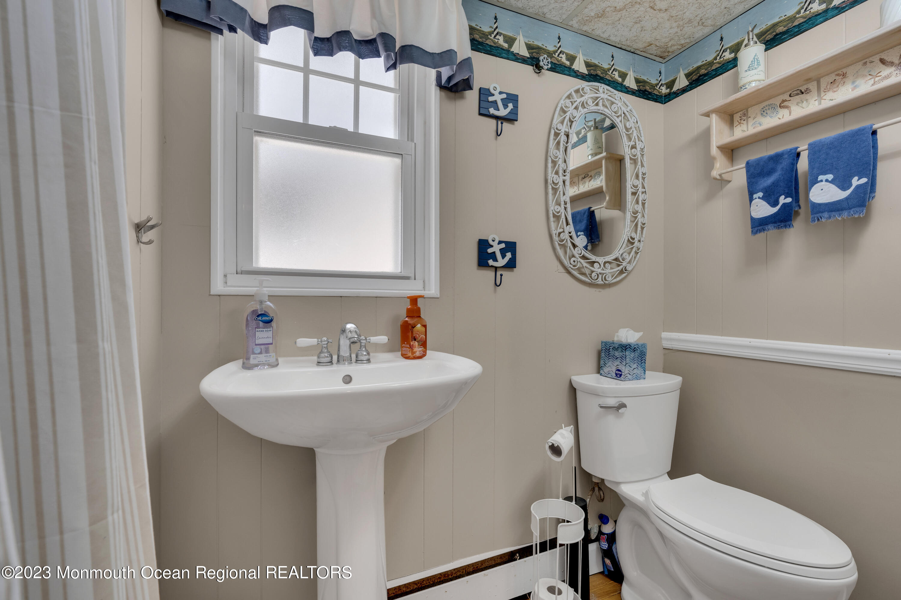 61 Beach Front Manasquan, NJ 08736 - Photo 14 of 20 a bathroom with a sink mirror and toilet