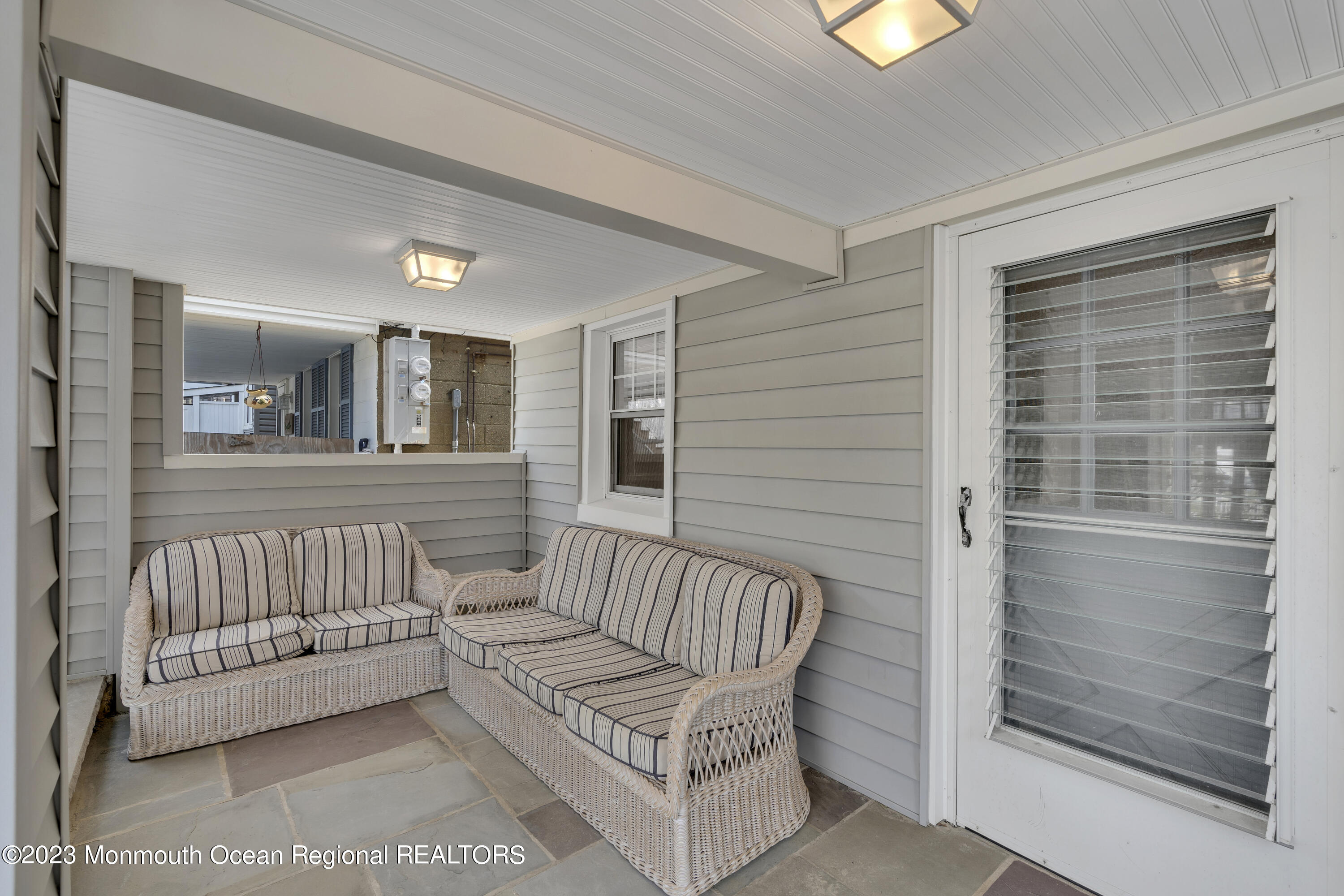 61 Beach Front Manasquan, NJ 08736 - Photo 17 of 20 a view of a bedroom with furniture and windows