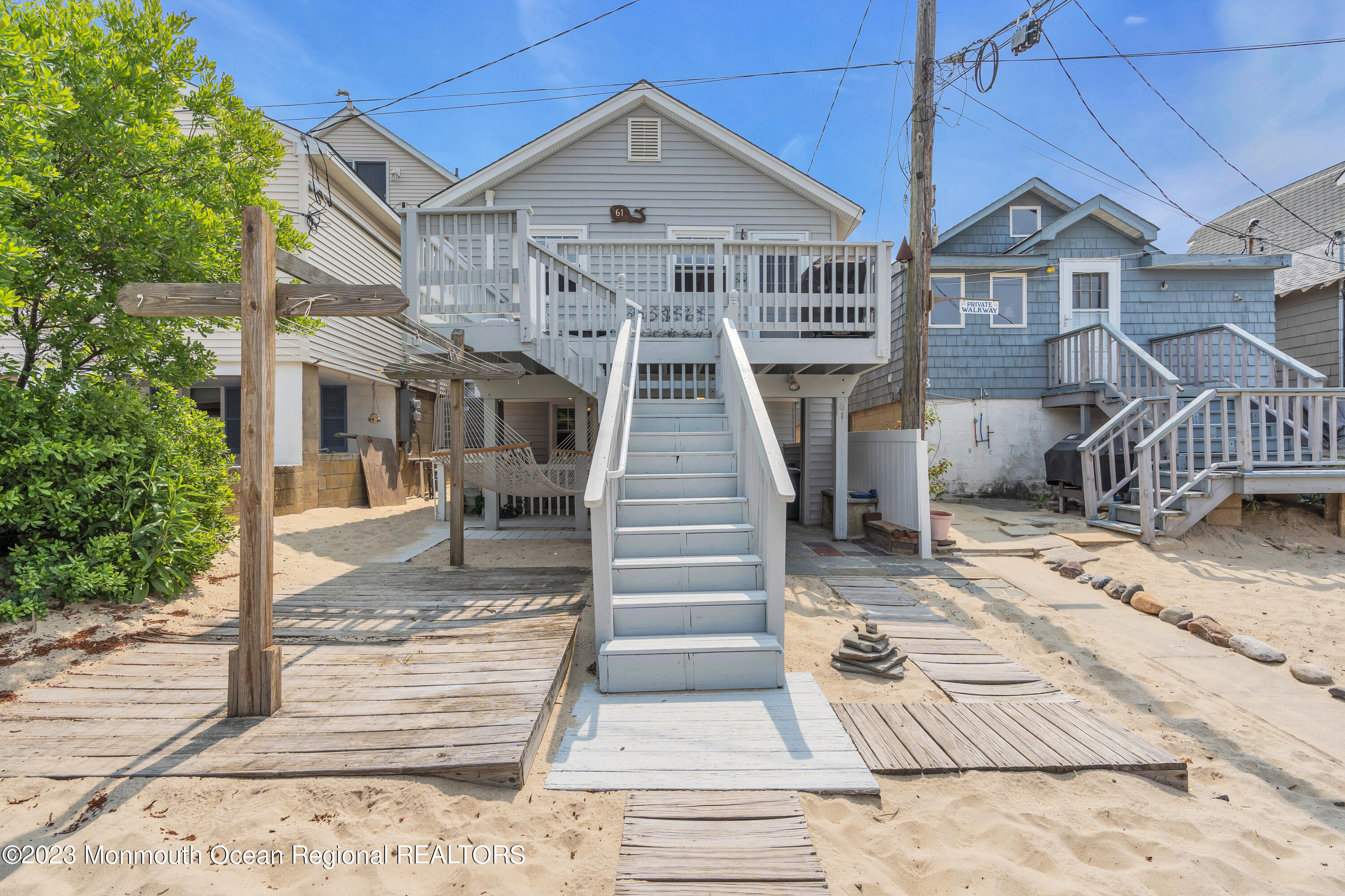 61 Beach Front Manasquan, NJ 08736 - Photo 20 of 20 a front view of a house with a yard