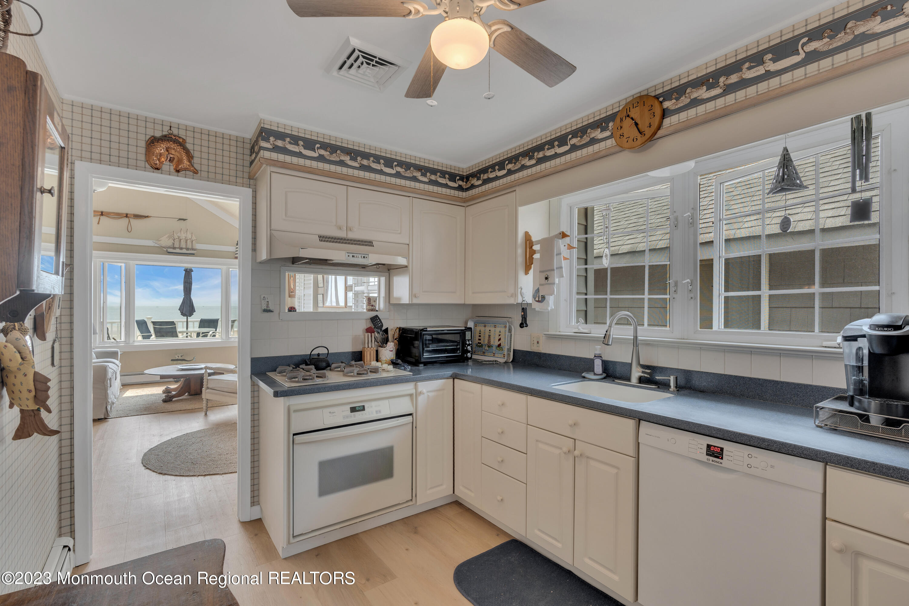 61 Beach Front Manasquan, NJ 08736 - Photo 7 of 20 a kitchen with stainless steel appliances granite countertop a stove a sink and a refrigerator
