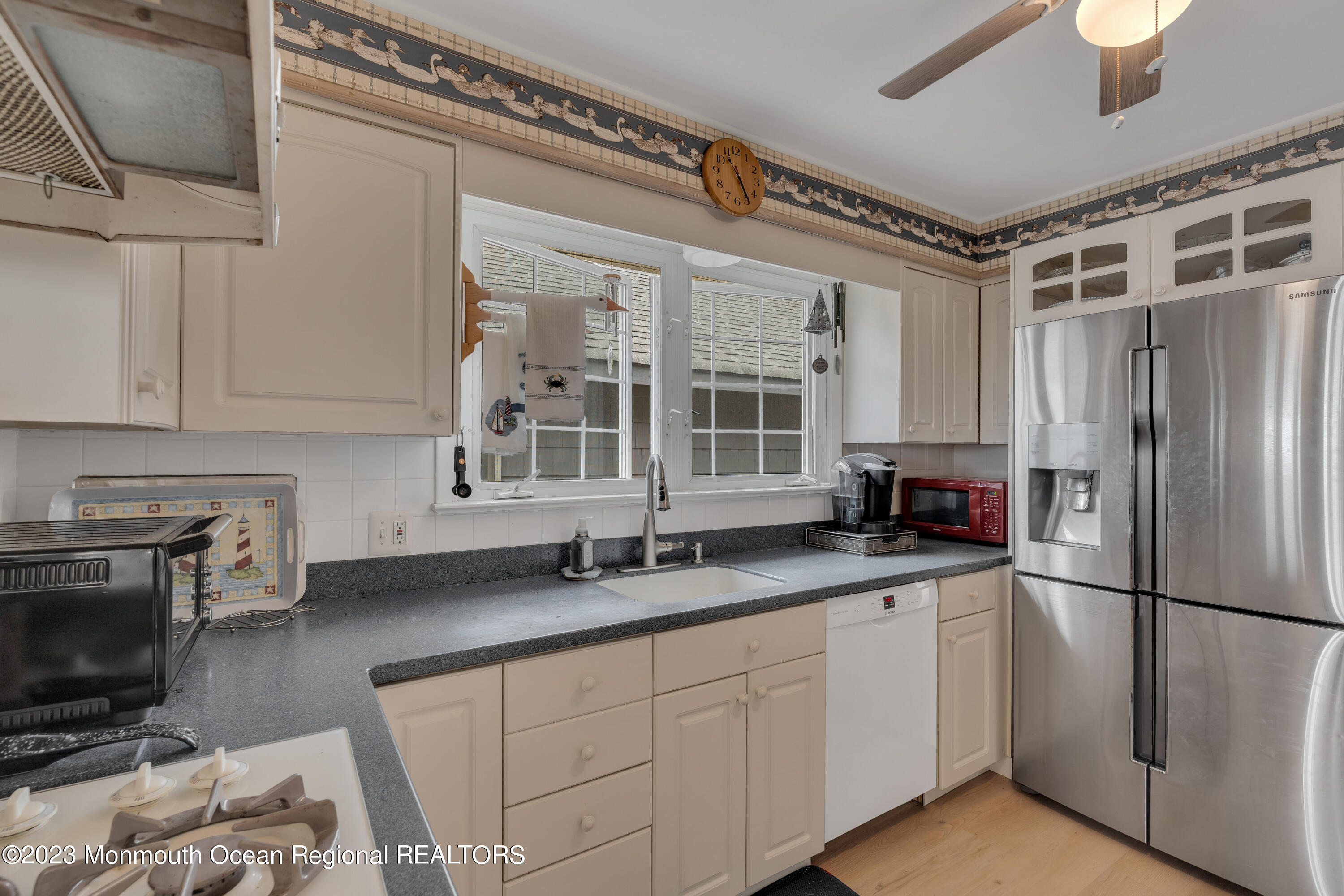61 Beach Front Manasquan, NJ 08736 - Photo 8 of 20 a kitchen with stainless steel appliances granite countertop a refrigerator sink and stove