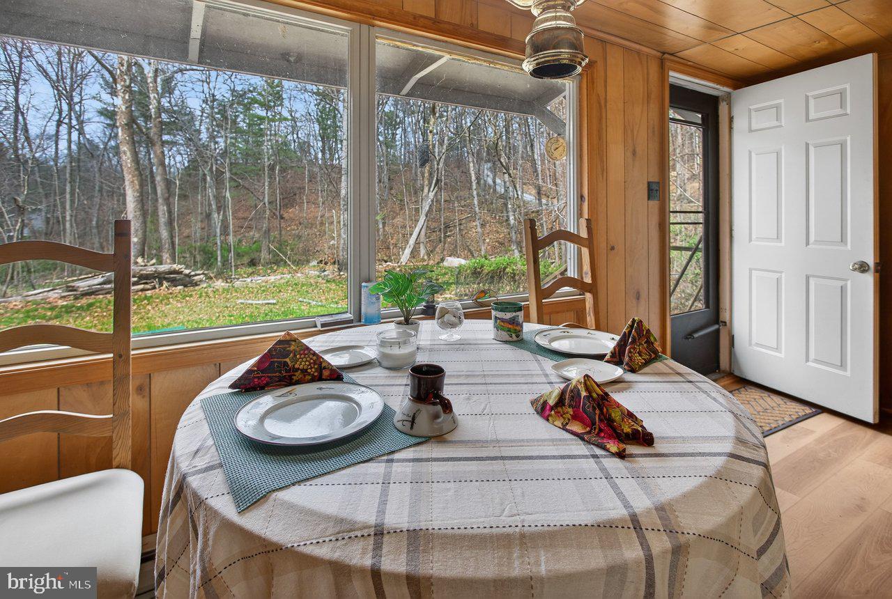 191 Hideaway Farms Road Edinburg, VA 22824 - Photo 12 of 40 a view of a dining room with furniture window and outside view