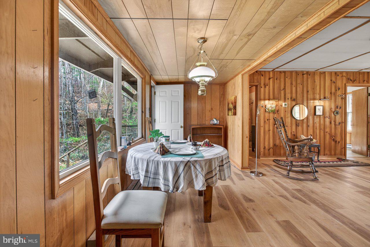 191 Hideaway Farms Road Edinburg, VA 22824 - Photo 13 of 40 a view of a dining room with furniture window and outside view