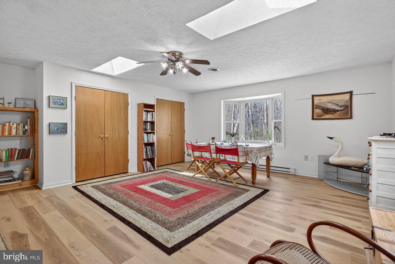 191 Hideaway Farms Road Edinburg, VA 22824 - Photo 15 of 40 a living room with furniture and a rug