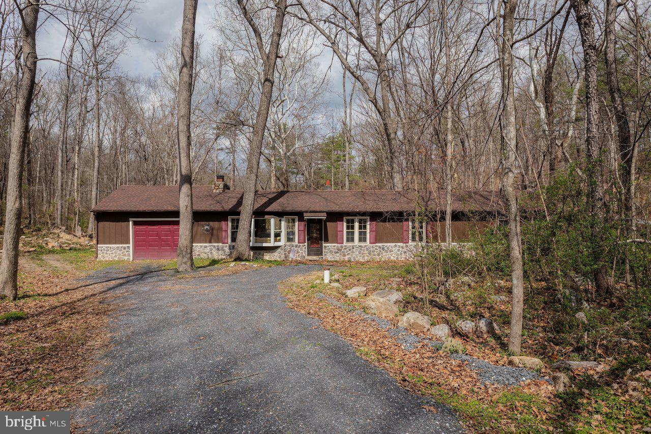 191 Hideaway Farms Road Edinburg, VA 22824 - Photo 2 of 40 a front view of a house with a yard