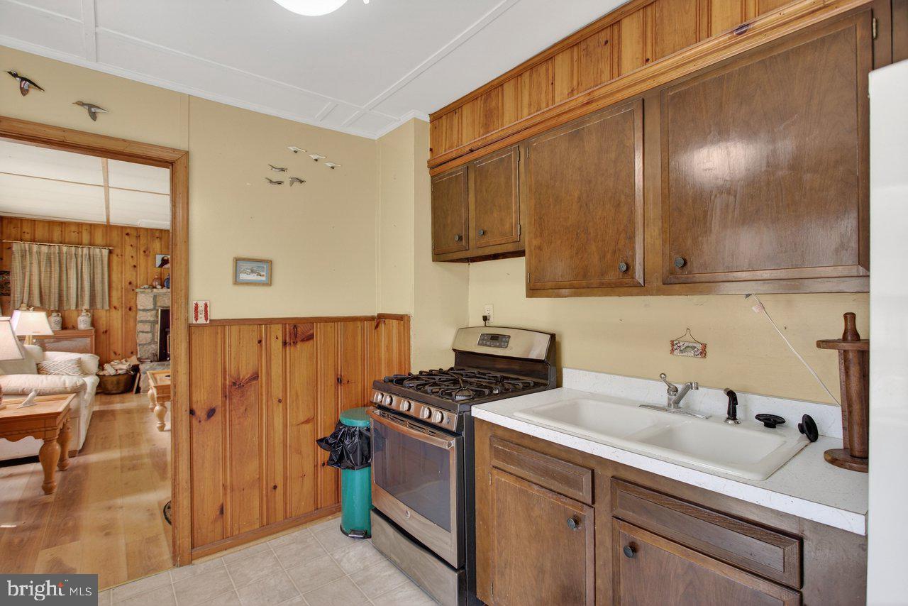 191 Hideaway Farms Road Edinburg, VA 22824 - Photo 21 of 40 a kitchen with a sink cabinets and appliances