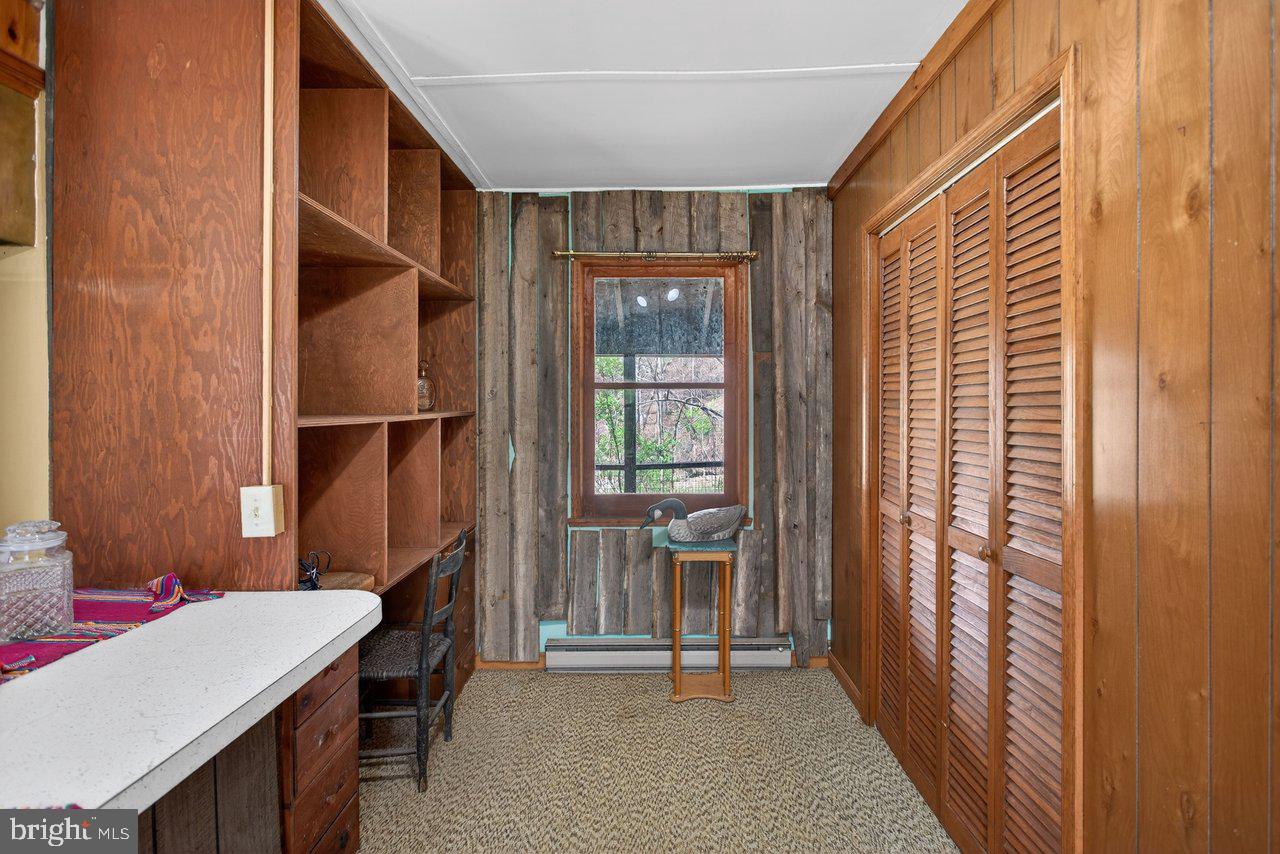 191 Hideaway Farms Road Edinburg, VA 22824 - Photo 24 of 40 a room that has a window and a table in it