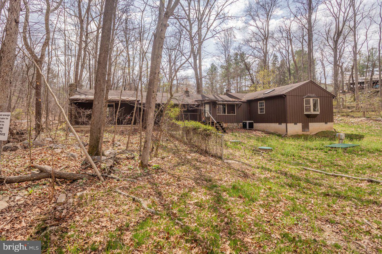 191 Hideaway Farms Road Edinburg, VA 22824 - Photo 36 of 40 a view of a house with a yard