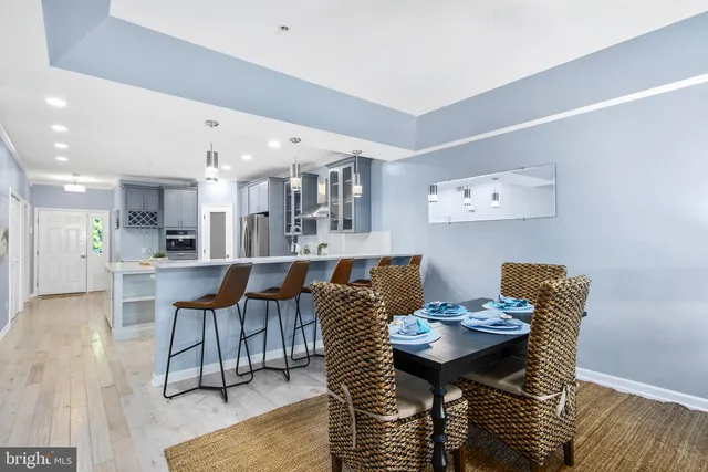 a view of a dining room with furniture and wooden floor
