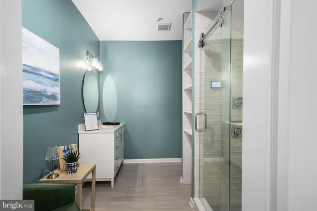 a bathroom with a toilet and a mirror