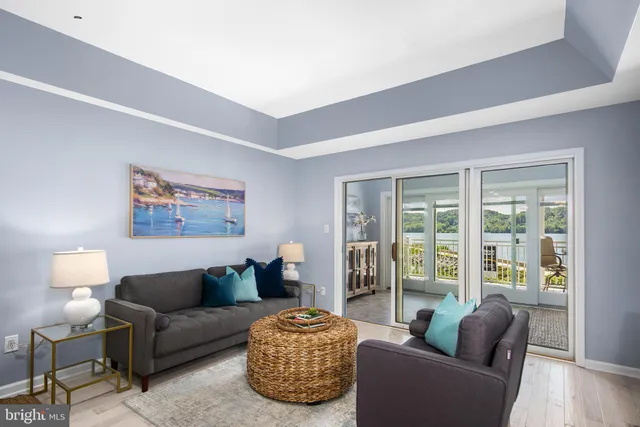 a living room with furniture and a lamp