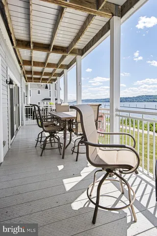 a view of a patio with table and chairs