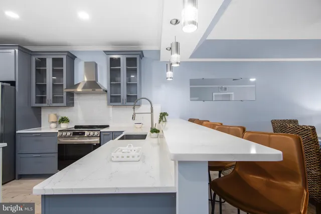 a kitchen with a table and chairs